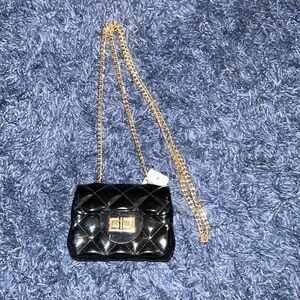 Patent leather jelly purse with gold tone chain. Black. NWT